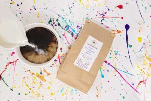 pouring cup of coffee by subscription bag