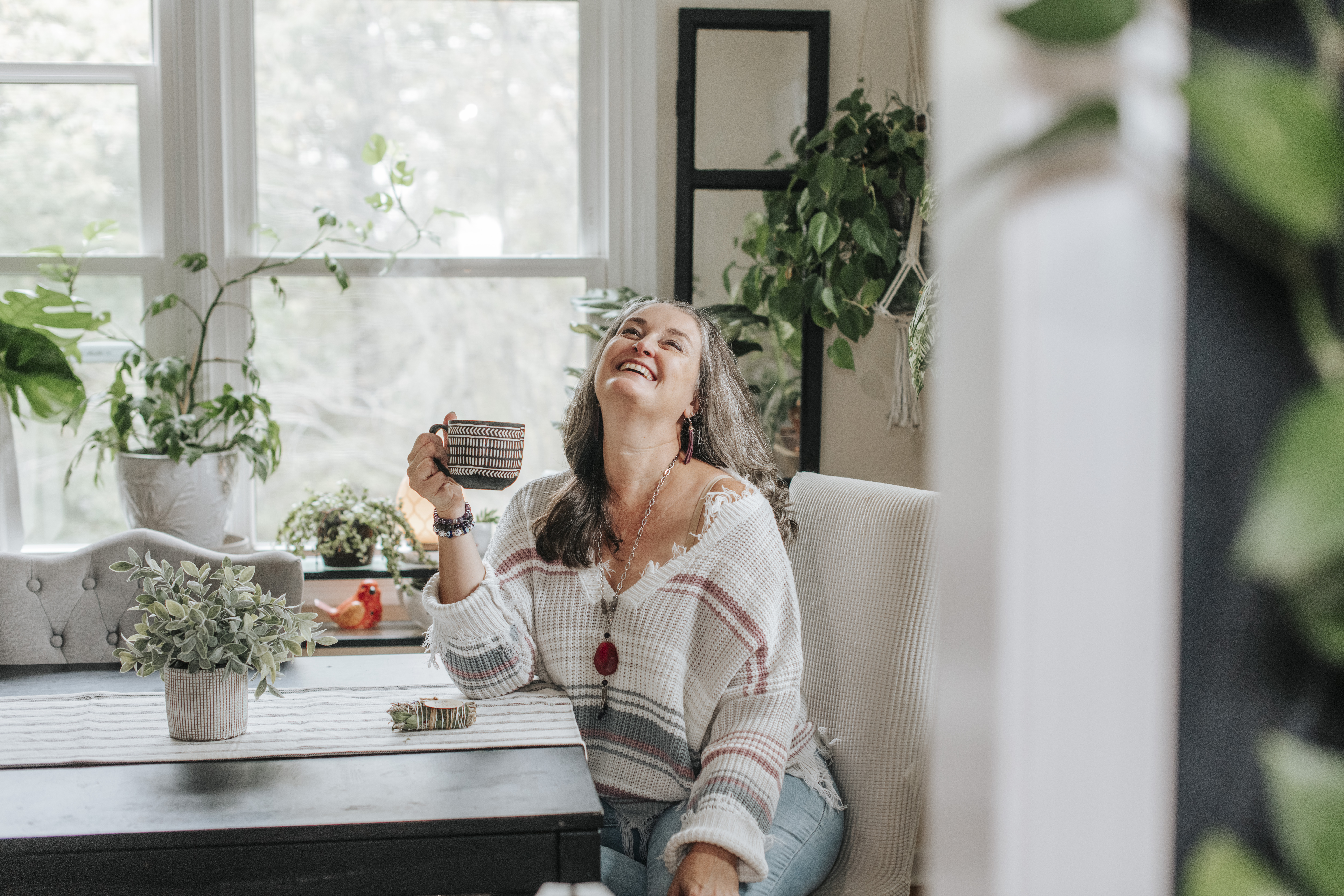 woman enjoying a cup of coffee at home